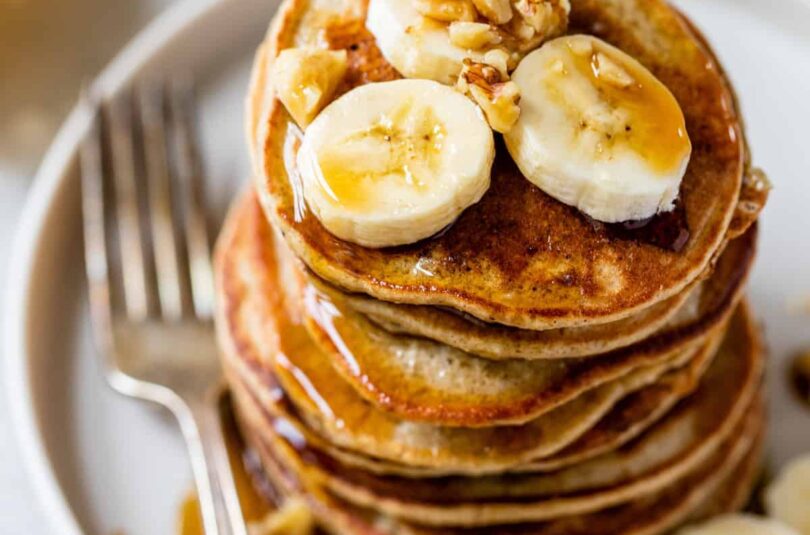 A stack of golden-brown gluten-free banana pancakes