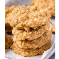 Stack of no-bake peanut butter oat cookies on a metal tray.