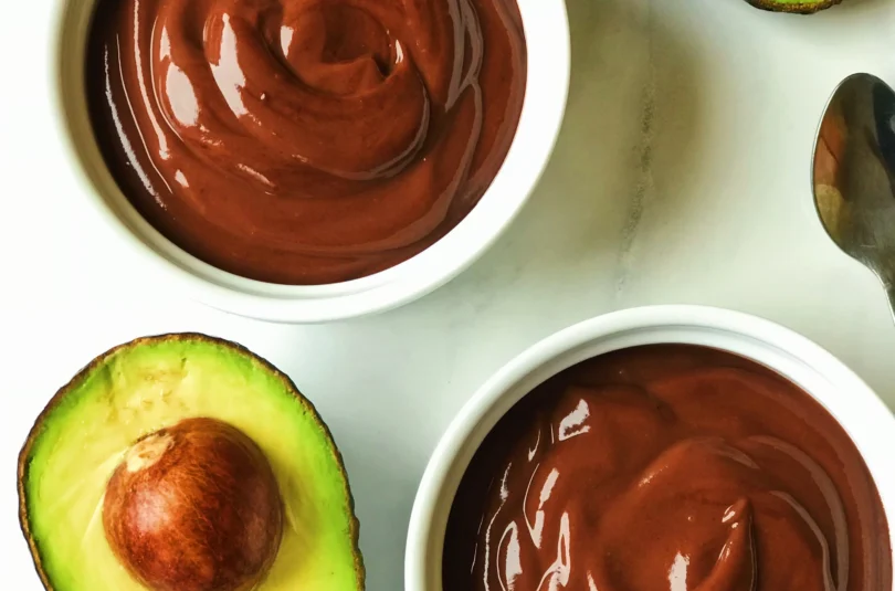 Delicious vegan chocolate avocado mousse served in a clear glass