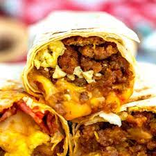 A cross-section view of a sausage and egg breakfast burrito